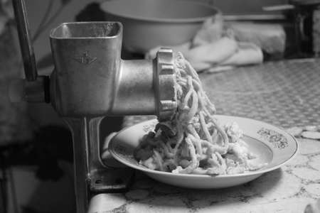 retro style steel meat grinder with  fresh beef press inの写真素材