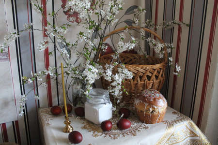 prepare for celebration Happy Easter bouquet of bloom  cherry, red eggs, salt, candle, cake on the...