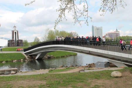view on chapel and bridge across the river Svisloch on island of tears memorial of warriors of war, Minsk, May, 2015, Belarusの写真素材