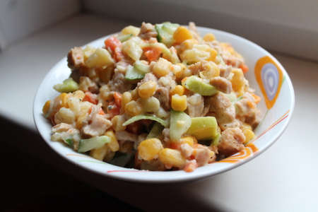 appetizing vegetarian salad from young corn under sauceの写真素材