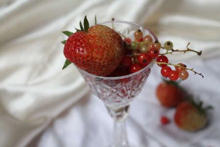 ripe fresh sweet juicy fruits lay in crystal glass beautiful holiday dessertの写真素材