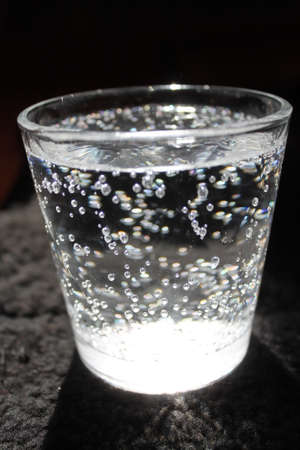 sparking bubbles water in glass