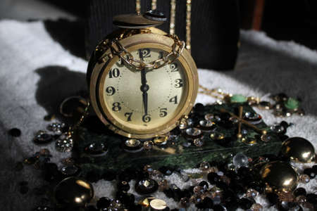 retro style bronze clock on the mable table decorated shine crystals for holiday decor