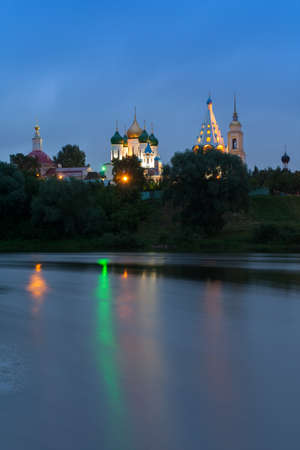Kolomna, Moscow Region. Various Temples And Belltower On Assumption Cathedral Square In Bright Illumination Under Blue Sky.  Beautiful View From River's Embankment.の写真素材