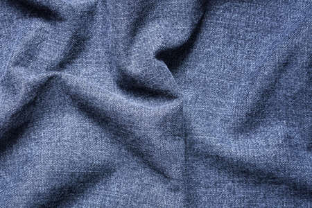 Abstract Texture Background Of Blue Gray Crumpled Jeans Cloth Top View And Close Up.の写真素材