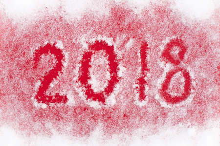 White Fluffy Snow On Red Paper With Inscription 2018 For Design. Close Up And Top View.