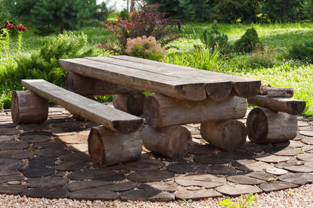 Empty Wooden Table With Benches In Summer Sunny Landscaping Garden Outdoor.の写真素材