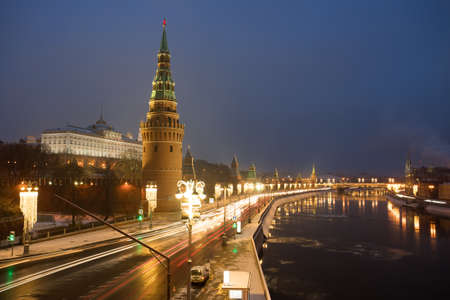Moscow, Russia. Beautiful Winter View Of Moscow Kremlin With Illumination Of Cars On Road By Moscow River, Covered With Thin Ice On Blue Hour.の写真素材