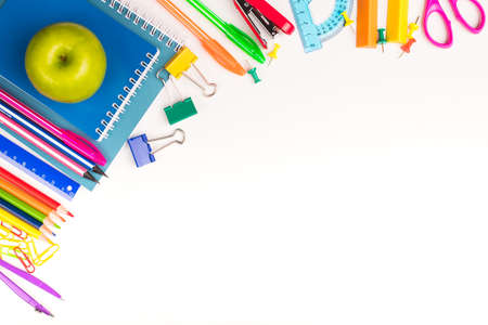 School Or Office Stationery With Green Fresh Apple On White Background Of Table With Copyspace Top View.の写真素材