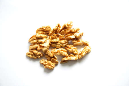 handful of fresh peeled walnuts on a white background. Healthy eating concept. Place for textの写真素材