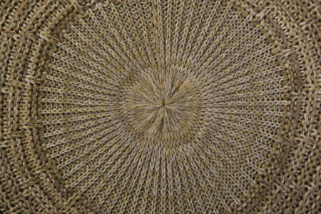 Close-up on a knitted beige thing. The circular texture. The trend for natural materials. Perfect...