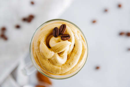 Top view close-up on a glass of cold coffee dalgon drink decorated with grains. Copy space.の写真素材