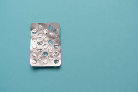 Blank blister from pills on a blue background with place for text. No drugs, pills, tablets, drugs.の写真素材