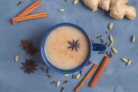 Traditional Indian hot tea with milk and spices. Masala tea. View from above. Place for text.の写真素材