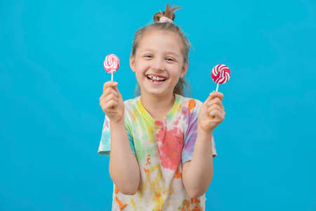 The concept of a holiday, fun entertainment and childrens joy. A cute dark-haired girl in a...