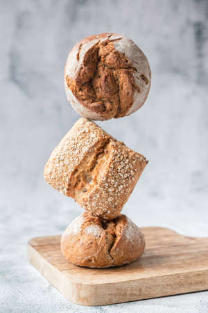 Balancing whole grain and regular buns, bread. Baking, bakery, bread makingの写真素材
