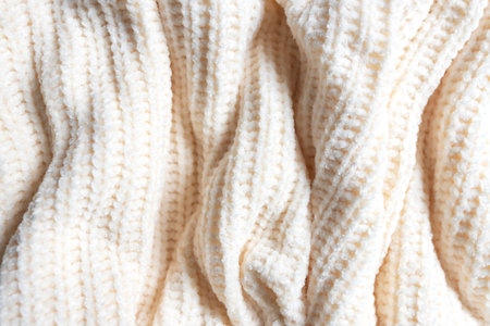 Fashionable knitted woolen fabric, abstract background. The texture of a soft warm sweater close-up. Knitted wool patternの写真素材