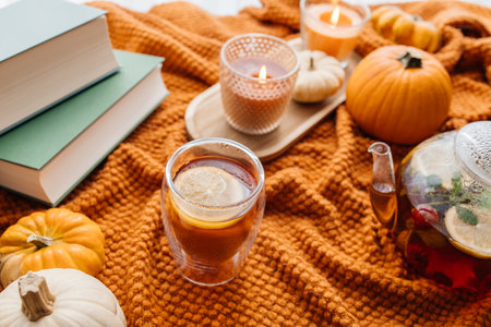 Autumn hygge concept with warm tea and pumpkinsの写真素材