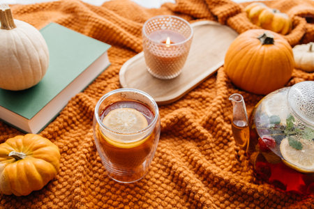 Autumn hygge concept with warm tea and pumpkinsの写真素材