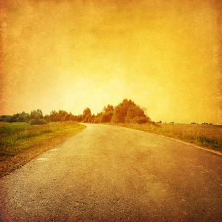 Road at sunset in grunge and retro style  の写真素材