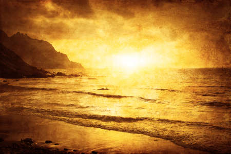 Seascape sunset in grunge and retro style.の写真素材