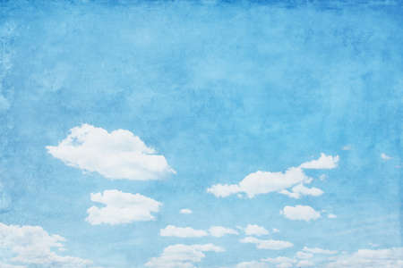 Blue sky with white clouds in grunge style.の写真素材