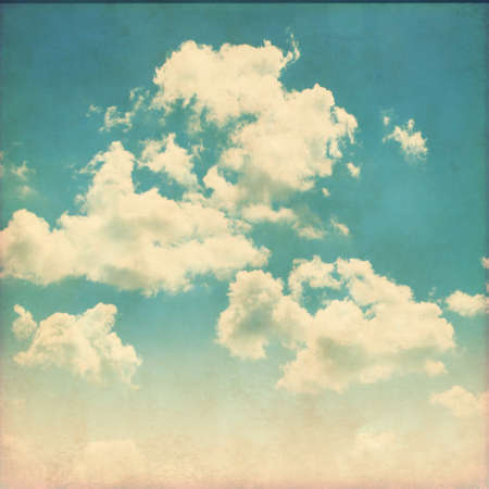 Blue sky with white clouds in grunge style.の写真素材