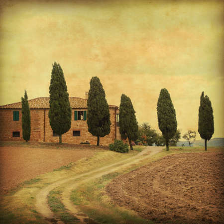 Farmhouse in Tuscany in grunge and retro style.の写真素材