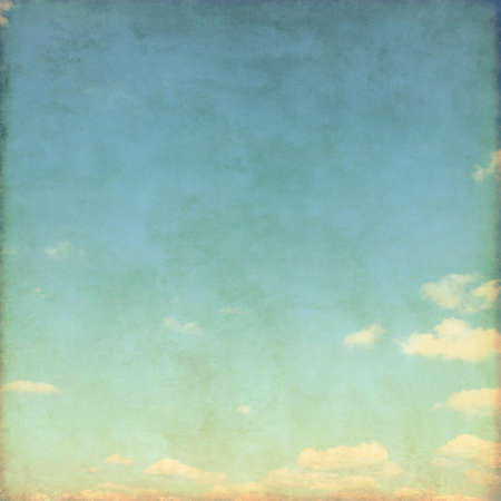Blue sky with white clouds in grunge and retro style.の写真素材