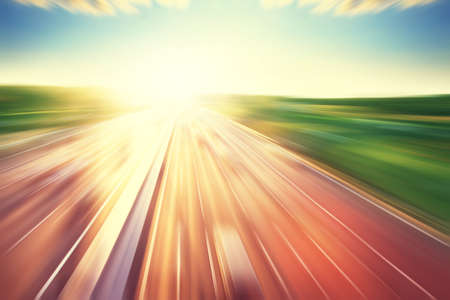 Motion blurred image of city traffic during sunset.の写真素材