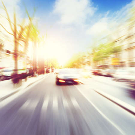 Car in motion blur on the street during sunset.の写真素材