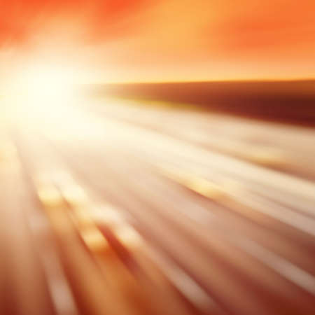 Traffic lights in motion blur during sunset.の写真素材