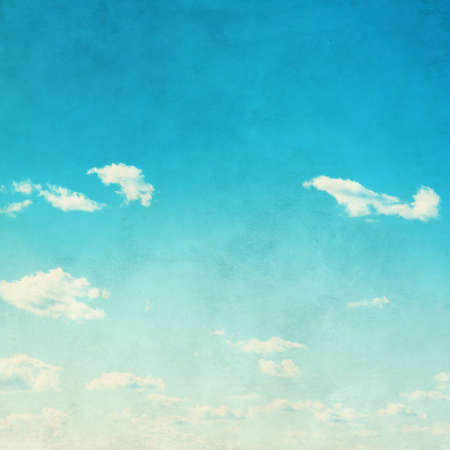 Blue sky with white clouds in grunge style.の写真素材
