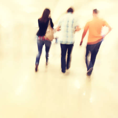 Motion blurred people walking in subway station.の写真素材