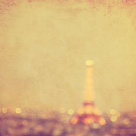 Defocused lights of night Paris in grunge and retro style.の写真素材