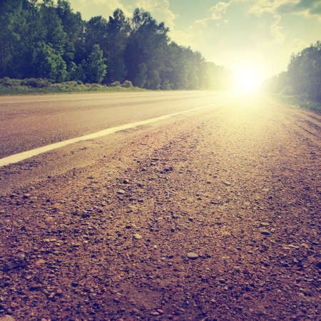 Country road at sunset. Vintage style.の写真素材