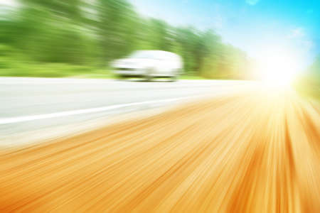 Car in motion blur and sunlight.の写真素材