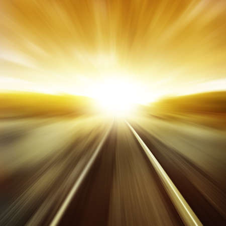 Toned image of railway in motion blur at sunset.の写真素材