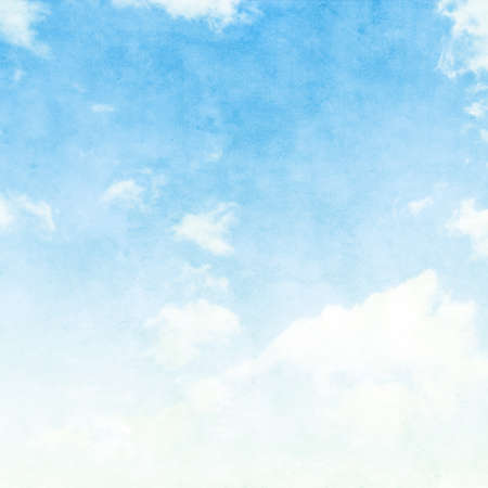 Blue sky with white clouds in grunge style.の写真素材