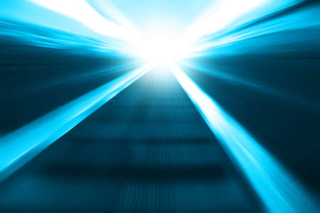 Moving escalator in motion blur and light on background.の写真素材