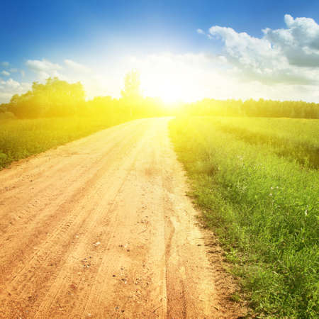 Rural road,blue sky and sunlight.の写真素材