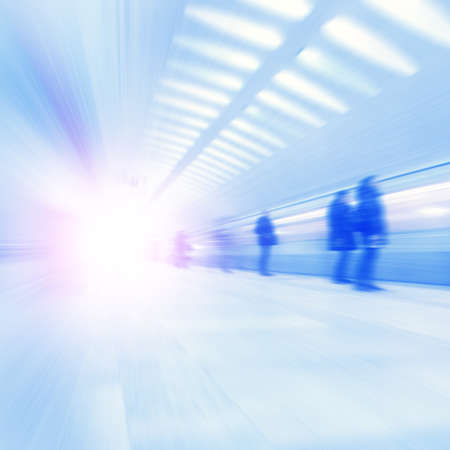 Train in motion blur and blurred people at subway station.の写真素材