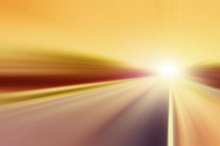 Country asphalt road in motion blur at sunset.の写真素材