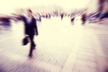 Motion blurred image of businessman walking in the city.の写真素材