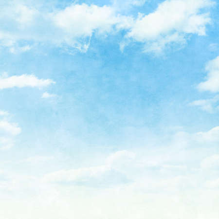 Blue sky with clouds in grunge style.の写真素材