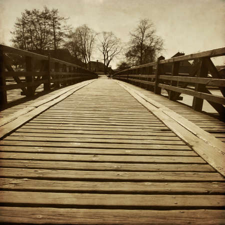 Wooden bridge in grunge and retro style.の写真素材