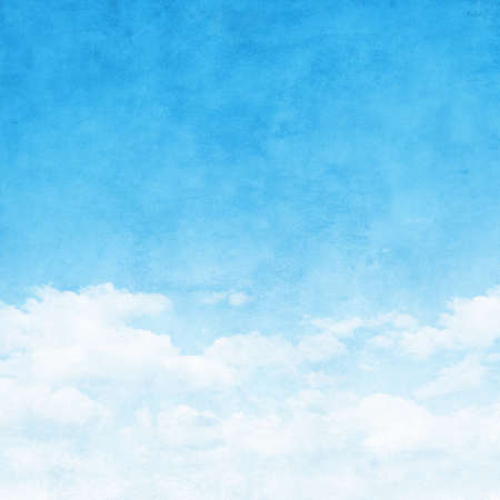 Blue sky with white clouds in grunge style.の写真素材