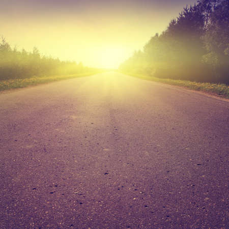 Country road at sunset in vintage style.の写真素材