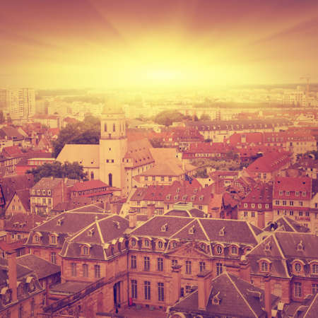 Aerial view of medieval house roofs in Strasbourg at sunset.の写真素材