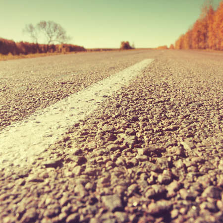 Empty country road in vintage style.の写真素材
